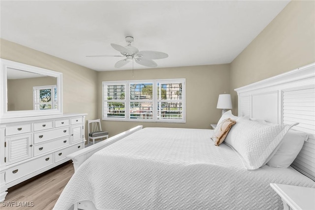 bedroom with a ceiling fan and wood finished floors