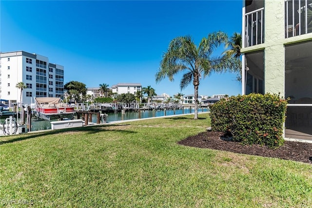 exterior space with a yard and a water view