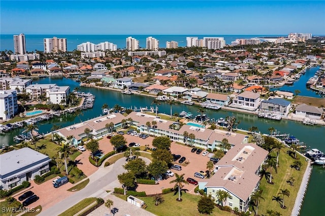 bird's eye view featuring a water view and a city view