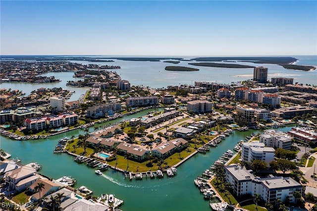 drone / aerial view featuring a view of city and a water view