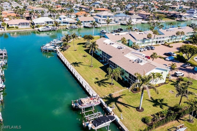 bird's eye view featuring a water view and a residential view