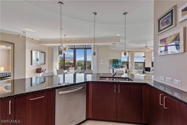 kitchen with open floor plan, dark stone countertops, plenty of natural light, and a sink