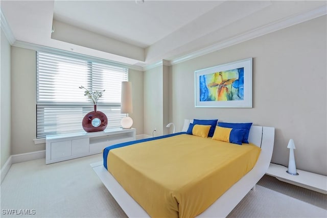 bedroom featuring carpet flooring, crown molding, and baseboards