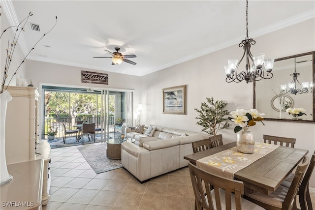 living room featuring light tile patterned floors, visible vents, ornamental molding, and ceiling fan with notable chandelier