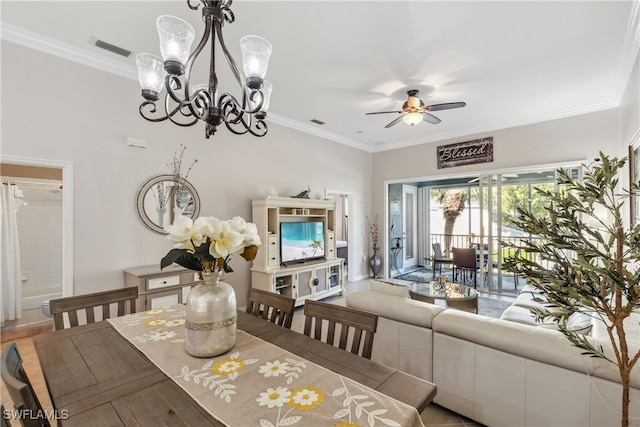 dining room with visible vents, crown molding, and ceiling fan with notable chandelier