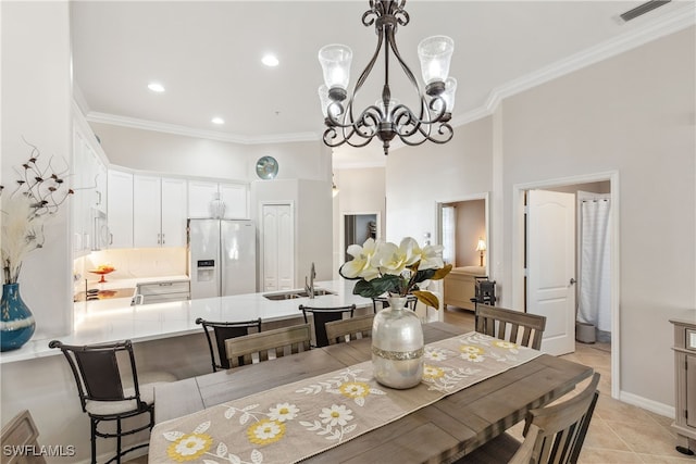 dining space with visible vents, light tile patterned flooring, a chandelier, and crown molding