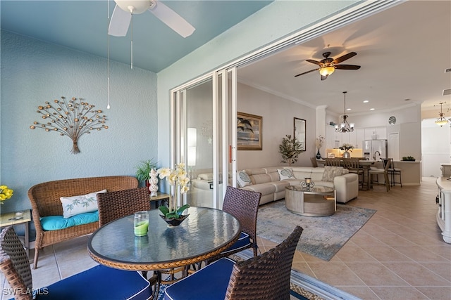 interior space with ceiling fan with notable chandelier