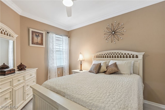 bedroom with baseboards, crown molding, and a ceiling fan