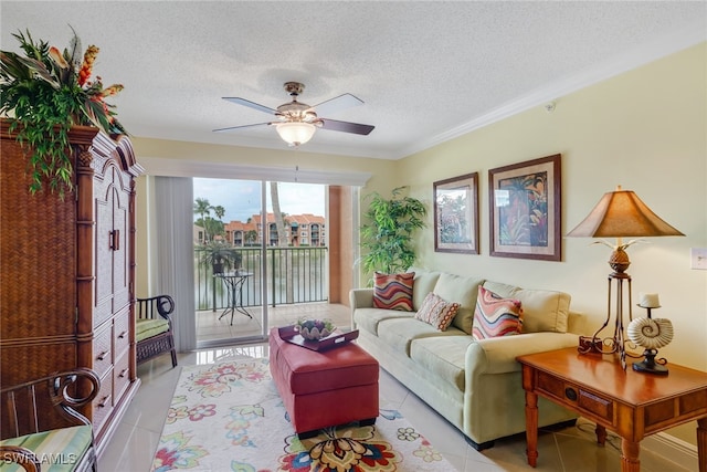 tiled living room with ornamental molding, a ceiling fan, and a textured ceiling