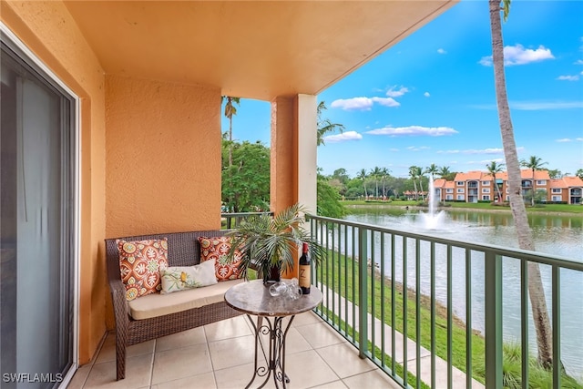 balcony featuring a water view