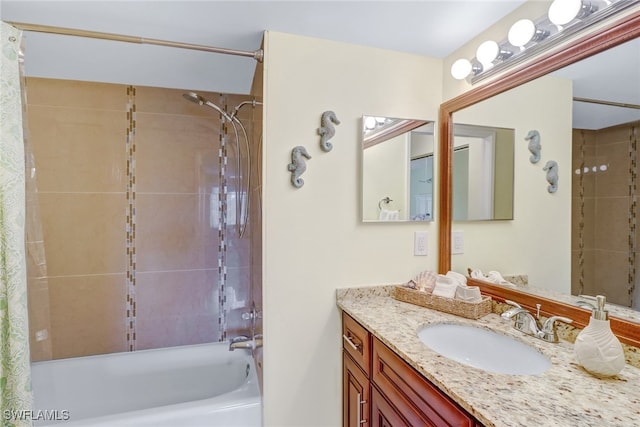 bathroom featuring vanity and shower / bath combo