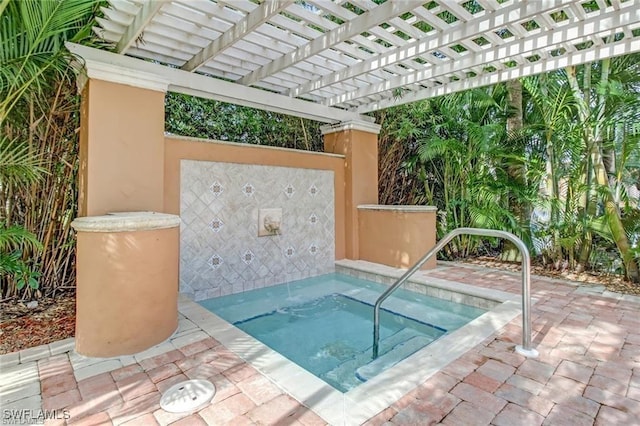 view of pool with a hot tub