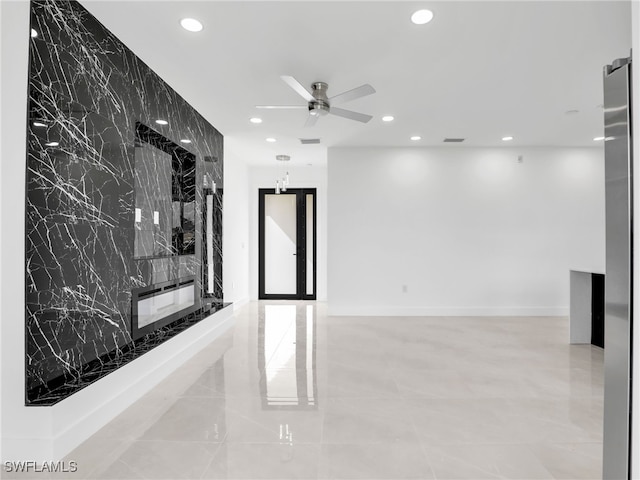 spare room with recessed lighting, visible vents, a ceiling fan, and an accent wall