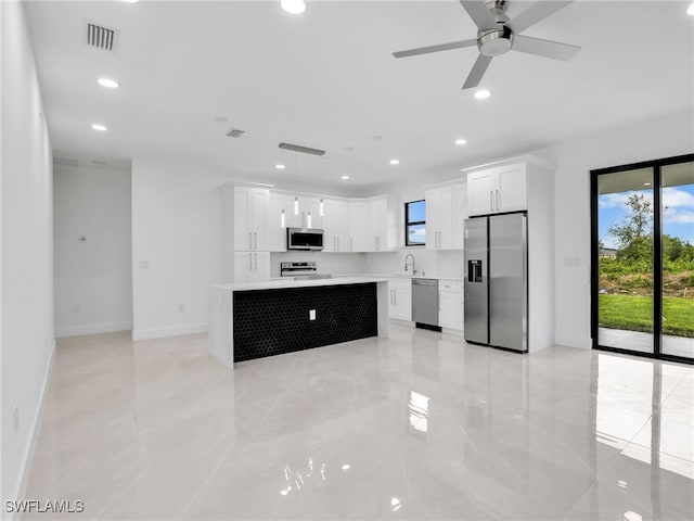 kitchen with visible vents, recessed lighting, a sink, light countertops, and appliances with stainless steel finishes