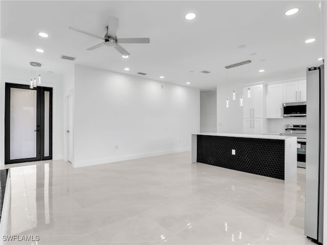 interior space featuring ceiling fan, recessed lighting, visible vents, and baseboards