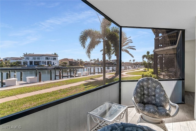 balcony featuring a water view