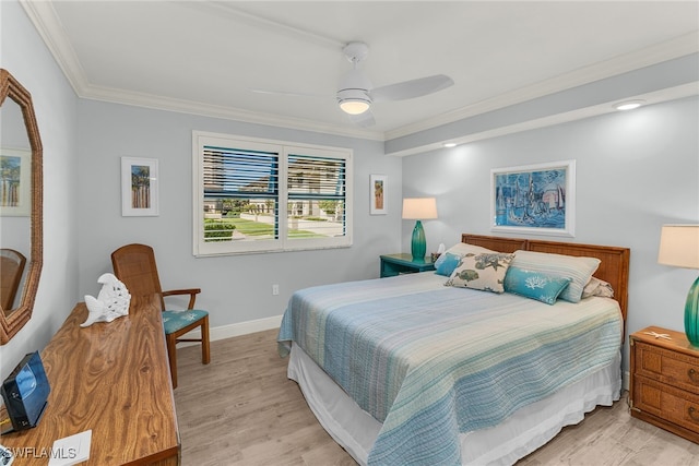 bedroom with light wood-style flooring, a ceiling fan, baseboards, and ornamental molding