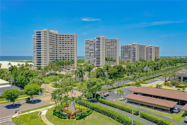 drone / aerial view featuring a water view and a city view