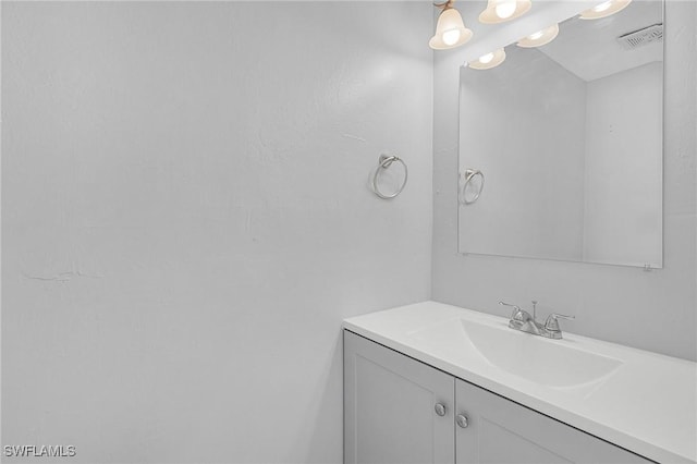 bathroom with visible vents and vanity