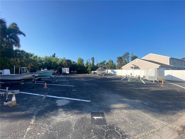 uncovered parking lot with fence