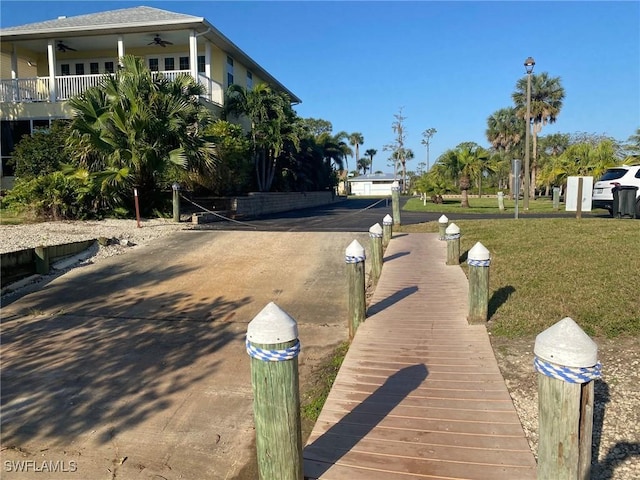 view of street featuring street lights and driveway