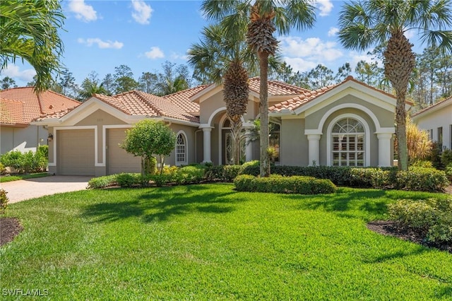 2874 Lone Pine Ln, Naples, FL 34119 - mediterranean / spanish-style house featuring a garage, a front lawn, a tile roof, and stucco siding