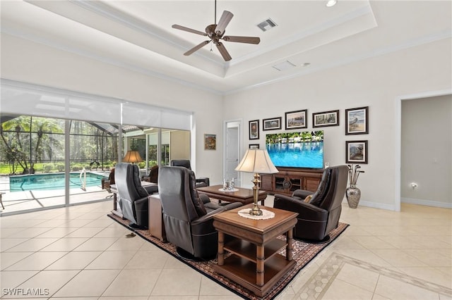 2874 Lone Pine Ln, Naples, FL 34119 - living area with light tile patterned flooring, a sunroom, a ceiling fan, a tray ceiling, and visible vents