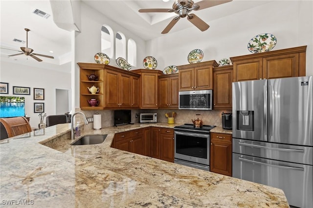 2874 Lone Pine Ln, Naples, FL 34119 - kitchen with visible vents, open shelves, a ceiling fan, a sink, and stainless steel appliances