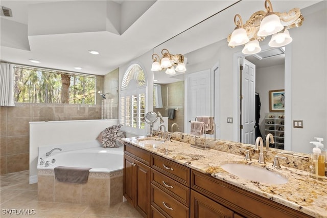 2874 Lone Pine Ln, Naples, FL 34119 - bathroom with a sink, double vanity, a bath, and a chandelier
