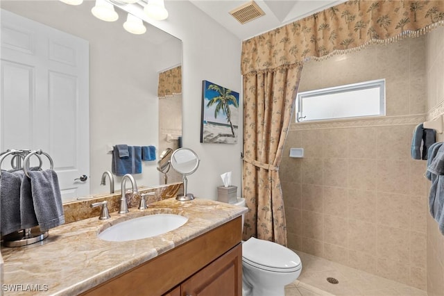 2874 Lone Pine Ln, Naples, FL 34119 - bathroom with visible vents, vanity, toilet, and tiled shower