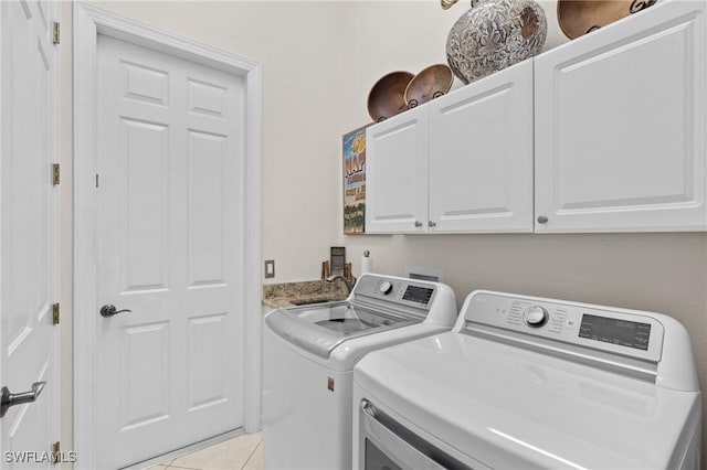 2874 Lone Pine Ln, Naples, FL 34119 - washroom featuring cabinet space, independent washer and dryer, and light tile patterned floors