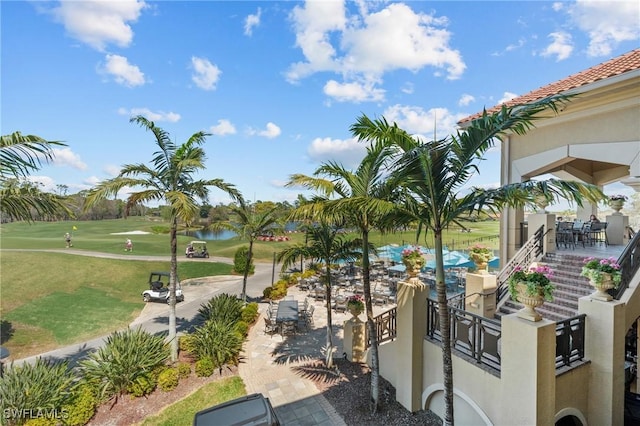 2874 Lone Pine Ln, Naples, FL 34119 - surrounding community with view of golf course and outdoor dining area