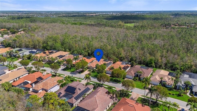 2874 Lone Pine Ln, Naples, FL 34119 - birds eye view of property featuring a view of trees and a residential view