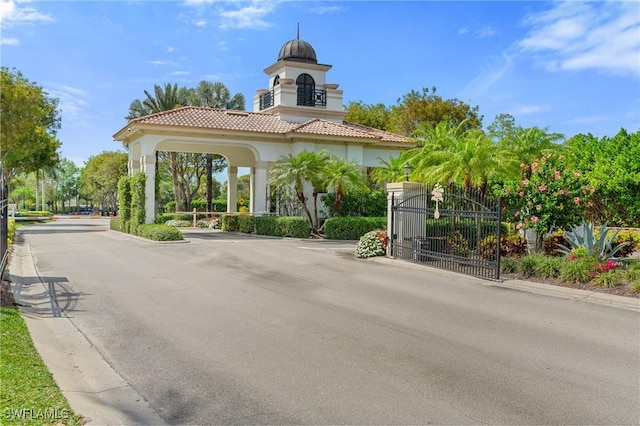 2874 Lone Pine Ln, Naples, FL 34119 - exterior space featuring curbs, a gated entry, and a gate