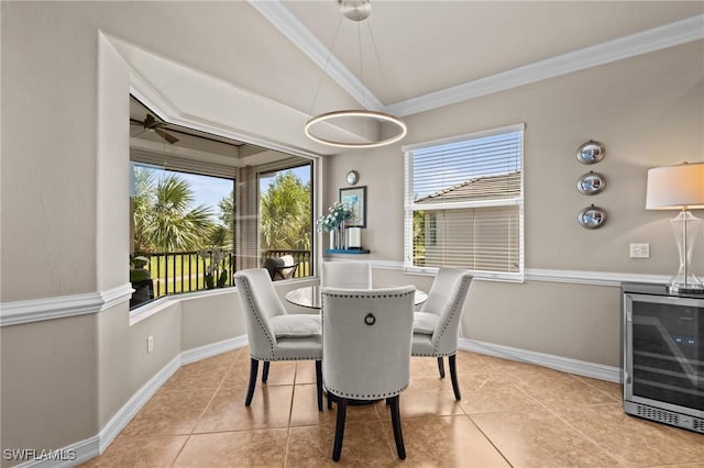 9330 Triana Ter Unit 274, Fort Myers, FL 33912 - dining area featuring light tile patterned floors, crown molding, baseboards, and beverage cooler