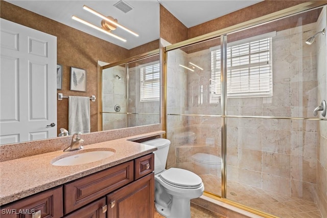 9330 Triana Ter Unit 274, Fort Myers, FL 33912 - full bathroom with toilet, vanity, a shower stall, and visible vents
