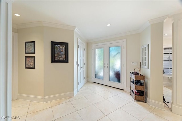 entrance foyer with crown molding, light tile patterned flooring, french doors, and baseboards