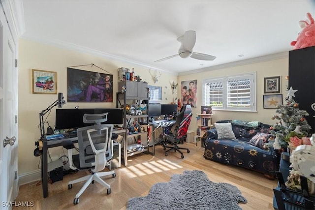 office area with a ceiling fan, wood finished floors, and ornamental molding