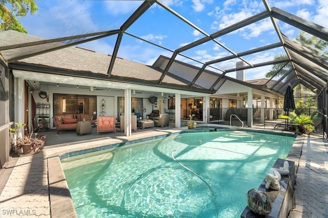 view of swimming pool featuring a fenced in pool, ceiling fan, glass enclosure, an outdoor hangout area, and a patio