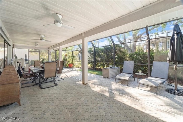 sunroom / solarium with wood ceiling and ceiling fan