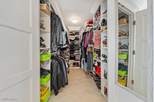 spacious closet with light tile patterned floors