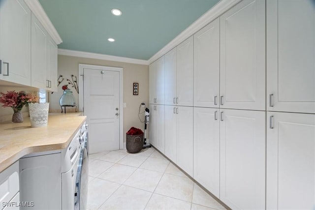 kitchen featuring light tile patterned floors, recessed lighting, light countertops, white cabinetry, and crown molding