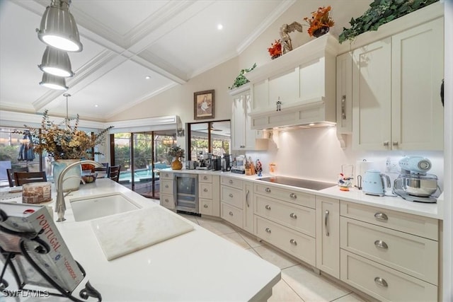 kitchen featuring black electric stovetop, beverage cooler, light tile patterned flooring, and crown molding