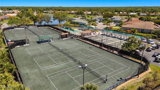 birds eye view of property featuring a residential view and a water view