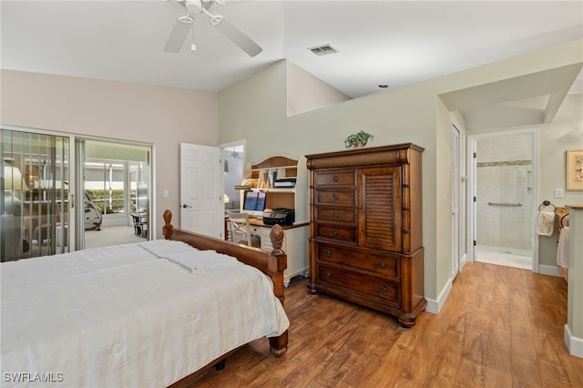 bedroom with access to exterior, visible vents, baseboards, vaulted ceiling, and wood finished floors