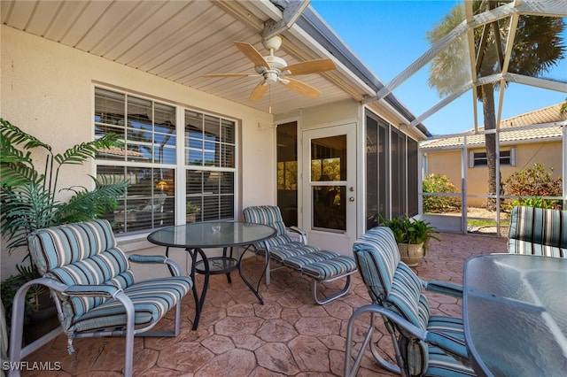 view of patio / terrace with a lanai and a ceiling fan