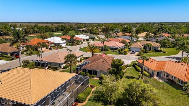 birds eye view of property with a residential view