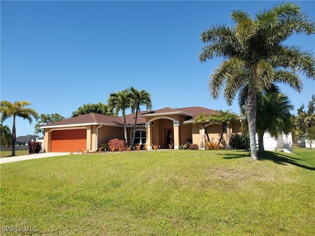 view of front of home featuring stucco siding, a front yard, concrete driveway, and an attached garage