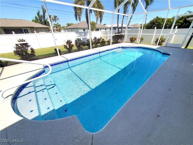 view of pool with a fenced in pool, a fenced backyard, a patio, and a lanai