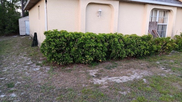 view of side of property with stucco siding